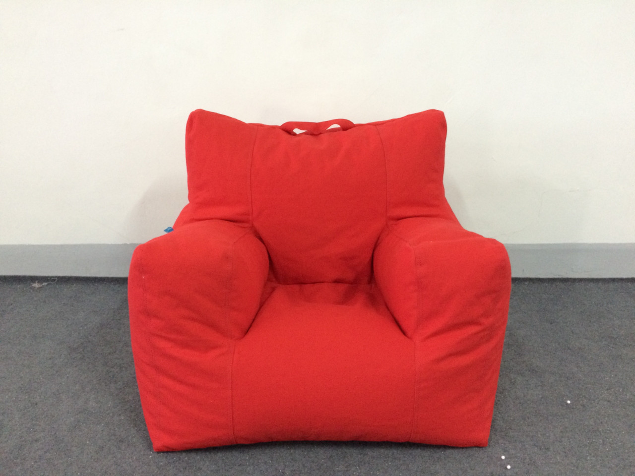 orange bean bag chair beach scene